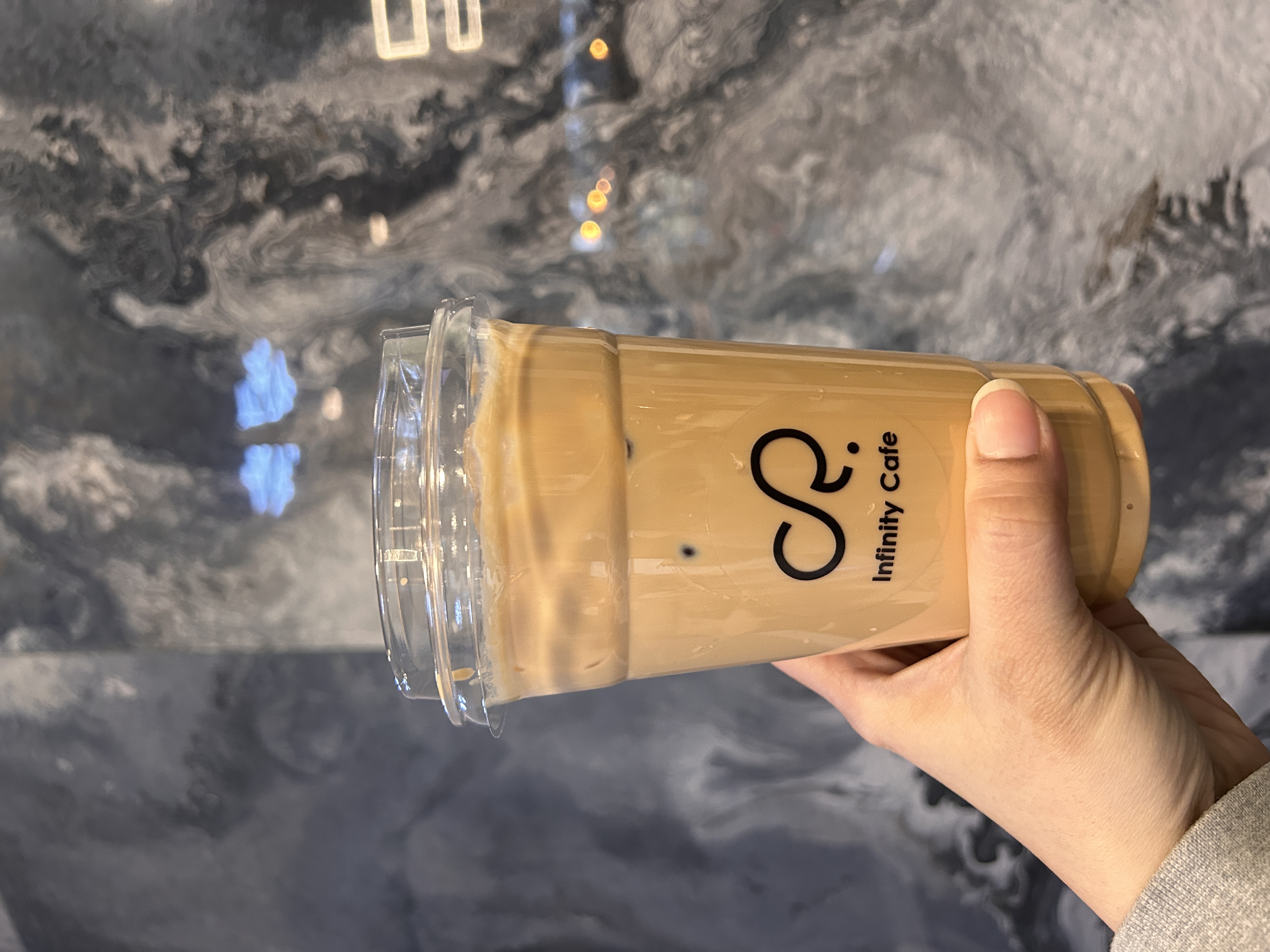 Infinity Latte at Infinity Cafe Surrey - Rich espresso blended with steamed milk and our signature infinity foam art